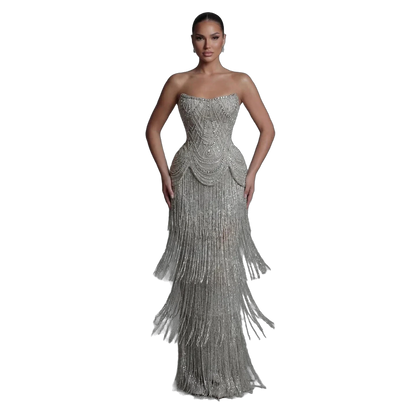 The Ghala – gray strapless tiered tassel mermaid gown | Riviera Couture