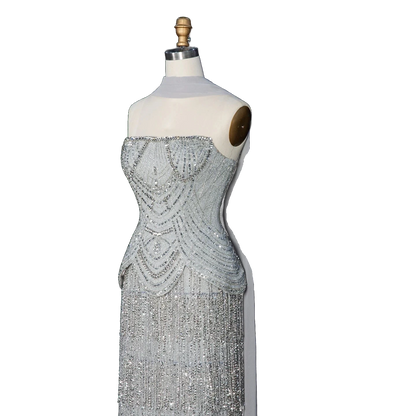 The Ghala – gray strapless tiered tassel mermaid gown | Riviera Couture