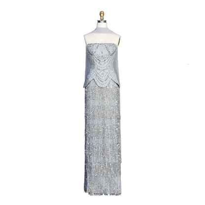 The Ghala – gray strapless tiered tassel mermaid gown | Riviera Couture
