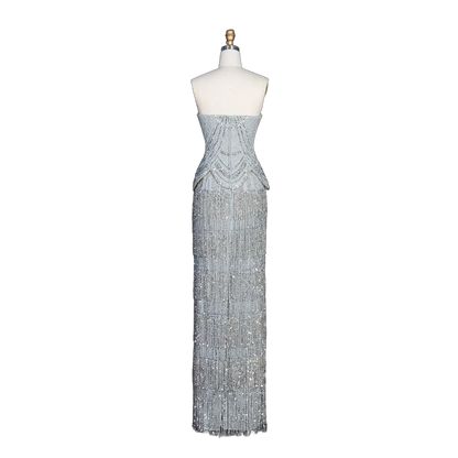 The Ghala – gray strapless tiered tassel mermaid gown | Riviera Couture