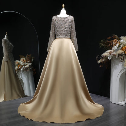 Champagne Beaded Long Sleeve Mermaid Evening Gown with Overskirt — Arabic — Riviera Couture GCC Luxury Evening Gown