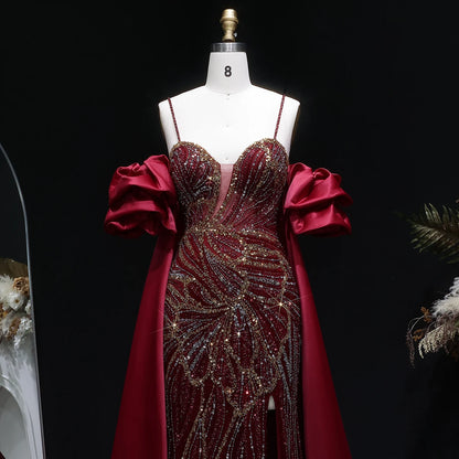 Wine Red Off-Shoulder Cape Ruffle Evening Gown — Beaded Luxury GCC Formal — Riviera Couture GCC Luxury Evening Gown