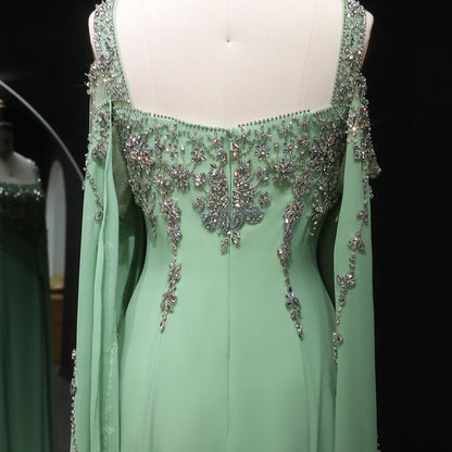 Blue Blue Crystal Evening Gown with Flowing Cape Sleeve — Arabic Luxury — Riviera Couture GCC Luxury Evening Gown