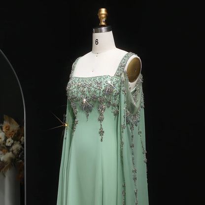 Green Blue Crystal Evening Gown with Flowing Cape Sleeve — Arabic Luxury — Riviera Couture GCC Luxury Evening Gown